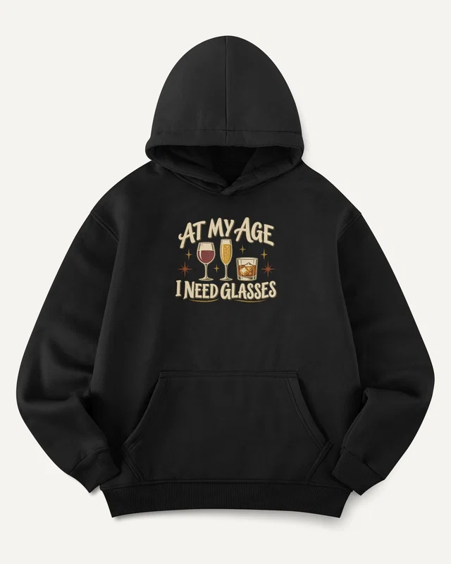 At My Age I Need Glasses Graphic Hoodie in Black — front